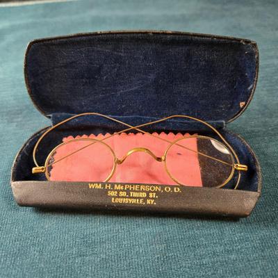 Sale Photo Thumbnail #514: This lot is for an Antique Eye Glass in Original Case. This is a nice set of Antique Eye Glasses with Original Case.  The case is clearly marked as to where it is from and has an Art Deco Design.  The eye glass rims are gold colored but not marked if they