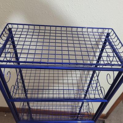 Sale Photo Thumbnail #570: 54" tall, 24" wide and 12" deep.
Store all the items you'll buy at this auction
Top flips backwards so one shelf has a back to it.