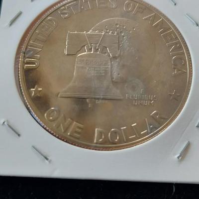 The Eisenhower dollar coin in the image is a Bicentennial issue, minted in 1975 and 1976 to celebrate the 200th anniversary of American...