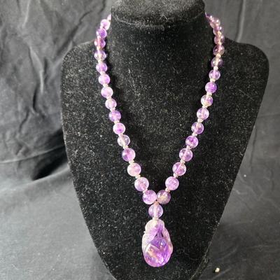 Sale Photo Thumbnail #529: This lot is for a Show Stopper Amethyst Necklace w/14K Gold Clasp. This is a stunning Amethyst Necklace.  The Beads are individually hand knotted in between and the main drop is hand carved.  The beads vary sequentially from large to small to the 14K Gold