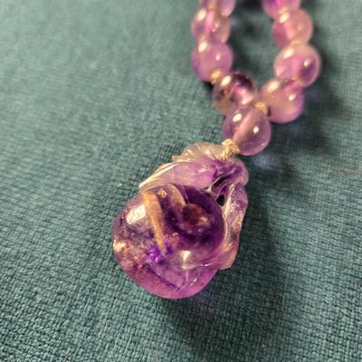 Sale Photo Thumbnail #531: This lot is for a Show Stopper Amethyst Necklace w/14K Gold Clasp. This is a stunning Amethyst Necklace.  The Beads are individually hand knotted in between and the main drop is hand carved.  The beads vary sequentially from large to small to the 14K Gold