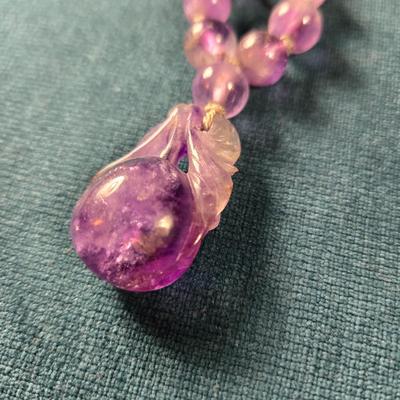 Sale Photo Thumbnail #532: This lot is for a Show Stopper Amethyst Necklace w/14K Gold Clasp. This is a stunning Amethyst Necklace.  The Beads are individually hand knotted in between and the main drop is hand carved.  The beads vary sequentially from large to small to the 14K Gold