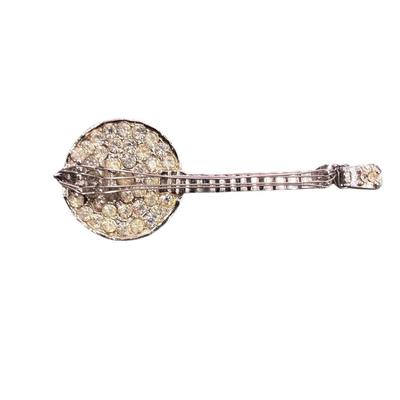 Sale Photo Thumbnail #511: Set Of Three Brooches  Banjo, Butterfly and Cameo