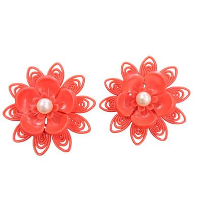 Sale Photo Thumbnail #520: Pair Of Vintage Orange Plastic Clip On Flower Earrings with a Faux Pearl Center