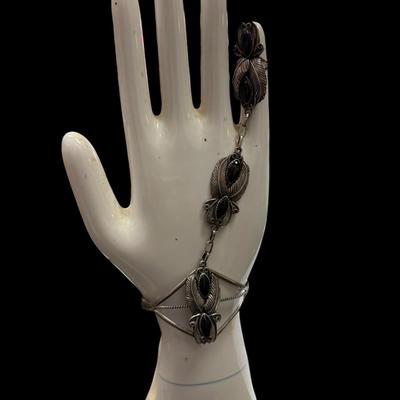 Sale Photo Thumbnail #530: Sterling Silver And Black Onyx Navajo Slave Bracelet   Total weight 300 grams