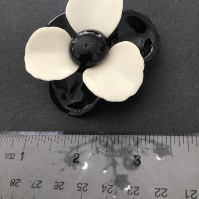 Vintage, black and white enamel flower brooch
