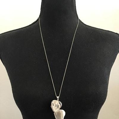 Vintage, sterling silver, 925 etched heart four way hinged heart locket that opens into a four leaf clover shaped design to hold small...