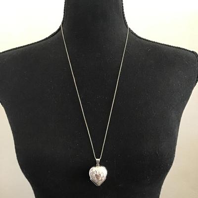 Vintage, sterling silver, 925 etched heart four way hinged heart locket that opens into a four leaf clover shaped design to hold small...