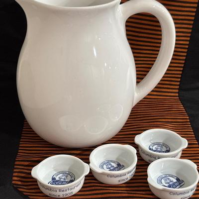 Large white ceramic pitcher and four Columbia dipping dishes