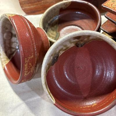 Pottery serving dishes and wood trivet!