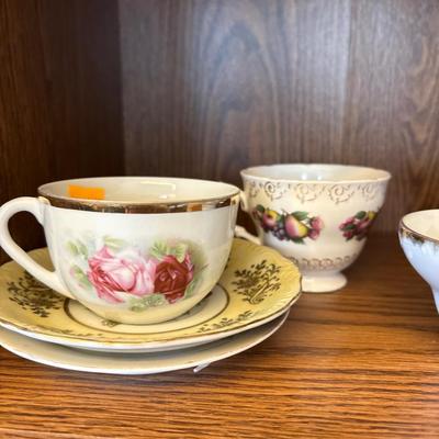 Coca-Cola and Stewart’s root beer bottles, crock, tea cups,