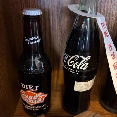 Coca-Cola and Stewart’s root beer bottles, crock, tea cups,