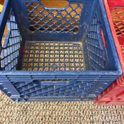 Blue Land O Lakes and red Marigold Foods crates