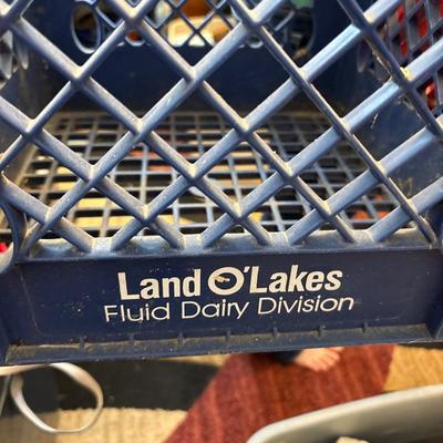 Blue Land O Lakes and red Marigold Foods crates