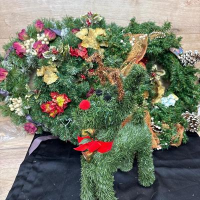 3 wreaths and a deer
