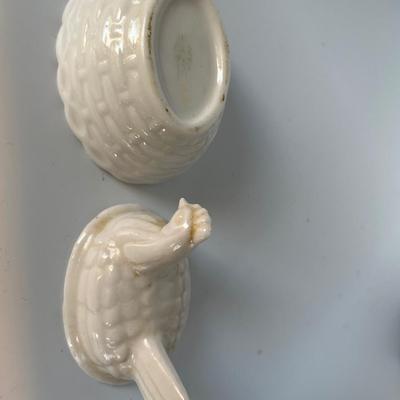 Brass mini cowboy boots and small chicken on nest