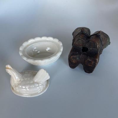 Brass mini cowboy boots and small chicken on nest