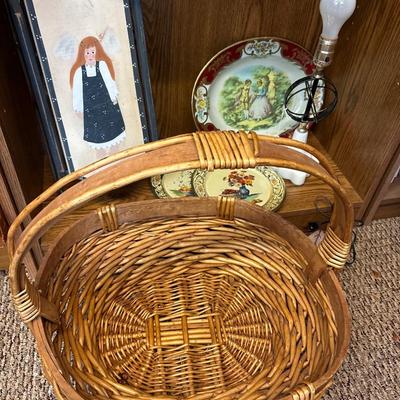 Large basket, milk glass lamp, metal trays, and sled