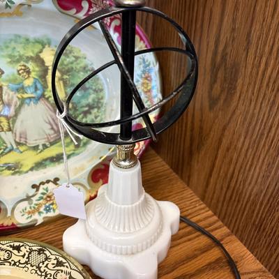 Large basket, milk glass lamp, metal trays, and sled