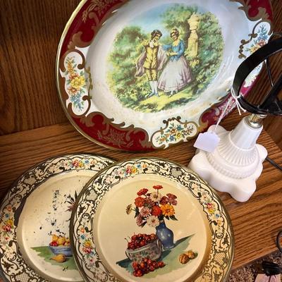 Large basket, milk glass lamp, metal trays, and sled