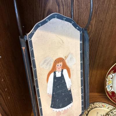 Large basket, milk glass lamp, metal trays, and sled