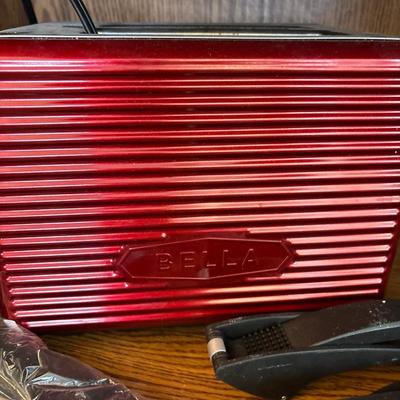 Iridescent bowl, Bella toaster, and four garlic presses
