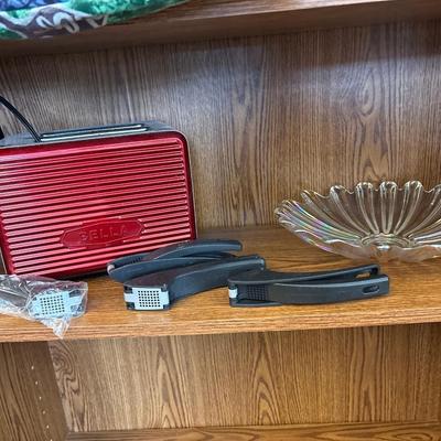 Iridescent bowl, Bella toaster, and four garlic presses