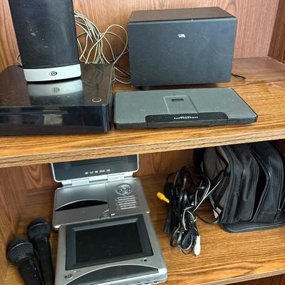 Portable DVD player with cords, microphones, and more