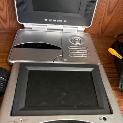 Portable DVD player with cords, microphones, and more