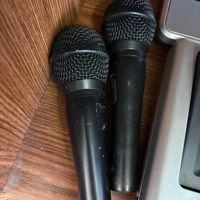 Portable DVD player with cords, microphones, and more