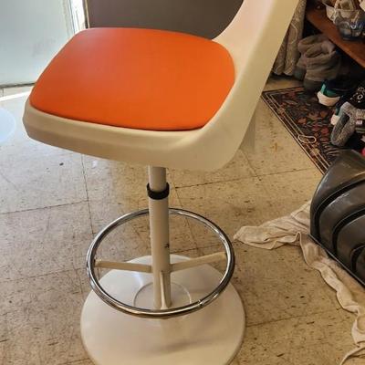 Sale Photo Thumbnail #29: You are bidding on one stool! There are 5 available. Arthur Umanoff designed with new orange upholstery. These are adjustable to 4 heights between 23" and 29"from floor to seat. This listing is the stool marked #3