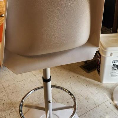 Sale Photo Thumbnail #52: You are bidding on one stool! There are 5 available. Arthur Umanoff designed with new orange upholstery. These are adjustable to 4 heights between 23" and 29"from floor to seat. This listing is the stool marked #5