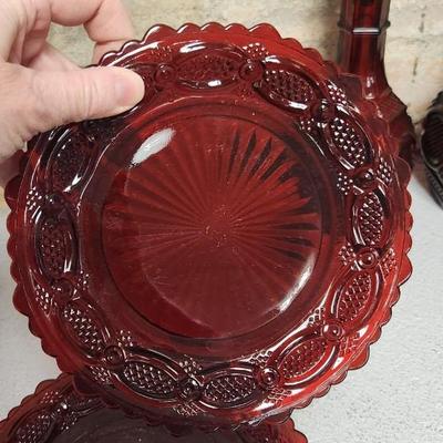 Sale Photo Thumbnail #159: Collection of Avon Cape Cod Ruby Glassware...note the broken stopper. Also, there is still cologne in the candlestick!!!