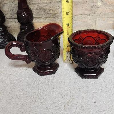 Sale Photo Thumbnail #155: Collection of Avon Cape Cod Ruby Glassware...note the broken stopper. Also, there is still cologne in the candlestick!!!