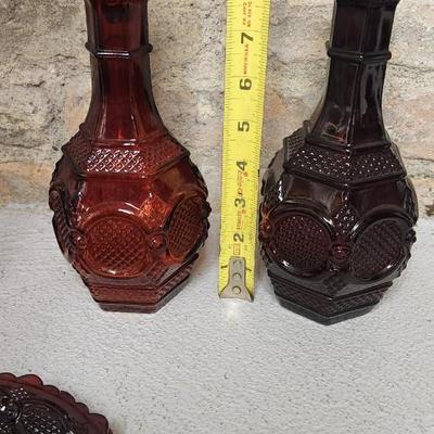 Sale Photo Thumbnail #162: Collection of Avon Cape Cod Ruby Glassware...note the broken stopper. Also, there is still cologne in the candlestick!!!