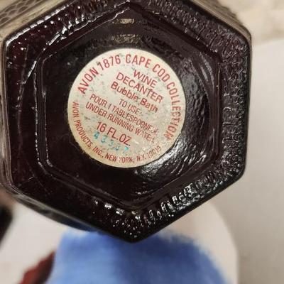 Sale Photo Thumbnail #164: Collection of Avon Cape Cod Ruby Glassware...note the broken stopper. Also, there is still cologne in the candlestick!!!