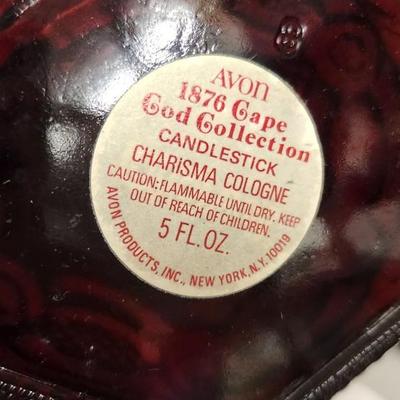 Sale Photo Thumbnail #154: Collection of Avon Cape Cod Ruby Glassware...note the broken stopper. Also, there is still cologne in the candlestick!!!