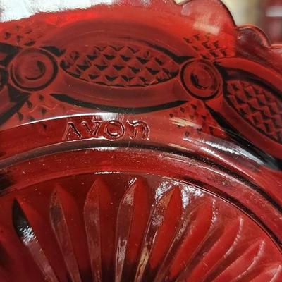 Sale Photo Thumbnail #160: Collection of Avon Cape Cod Ruby Glassware...note the broken stopper. Also, there is still cologne in the candlestick!!!