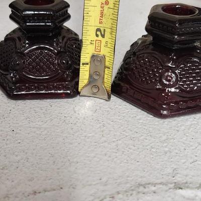 Sale Photo Thumbnail #166: Collection of Avon Cape Cod Ruby Glassware...note the broken stopper. Also, there is still cologne in the candlestick!!!