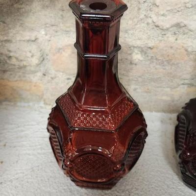 Sale Photo Thumbnail #163: Collection of Avon Cape Cod Ruby Glassware...note the broken stopper. Also, there is still cologne in the candlestick!!!