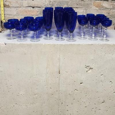 Sale Photo Thumbnail #266: A large mess of cobalt stemware, some chippy