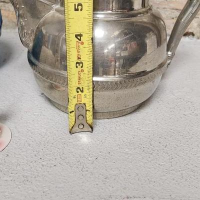Sale Photo Thumbnail #307: Gorgeous blue chiseled Blessings vase, a very old silver teapot and a sweet blown bride and groom