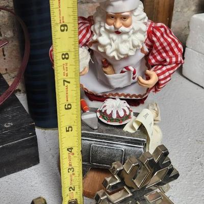 Sale Photo Thumbnail #405: 2 cute kitchen Santa's, a couple tins, stocking hangers and a metal reindeer basket