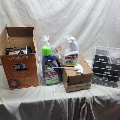 Sale Photo Thumbnail #818: Crockpot is used, carpet cleaning chemicals were still boxed and no cracks in plastic storage drawers assembly