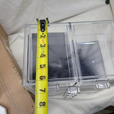 Sale Photo Thumbnail #825: Crockpot is used, carpet cleaning chemicals were still boxed and no cracks in plastic storage drawers assembly