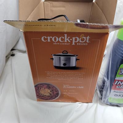 Sale Photo Thumbnail #819: Crockpot is used, carpet cleaning chemicals were still boxed and no cracks in plastic storage drawers assembly