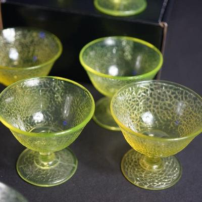 Sale Photo Thumbnail #6: Lot 1

L.E Smith Glass  EArly 20th century.Vaseline crackle glass sherbet dessert set 
unique set of sherbets with plates. 
three mold blown 
There are two colors in the mix. One is the vaseline color for the sherbets except two are yellow . the plates ar