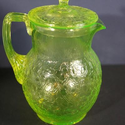 Sale Photo Thumbnail #15: Lot 3

Original vaseline glass pitcher with lid. 
Maker unknown, Tiffin , L.E Smith, / not marked and no match found

The yellow glass has a green hue
glows with black light uranium glass
Height of pitcher base to the finail on lid :10"
Width at the cente