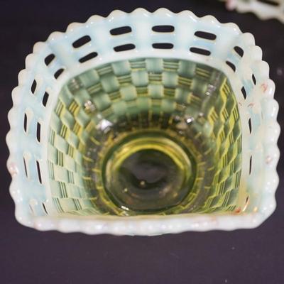 Sale Photo Thumbnail #33: At auction is a grouping of three Fenton candy dishes in the basket weave pattern, 
Lacy edge of opalescent glass. 
Mold blown 
early 1930's 
Uranium content glows under UV light 

round bowl measures: 7" across the top 
Height : 1 3/4" 
condition; very g