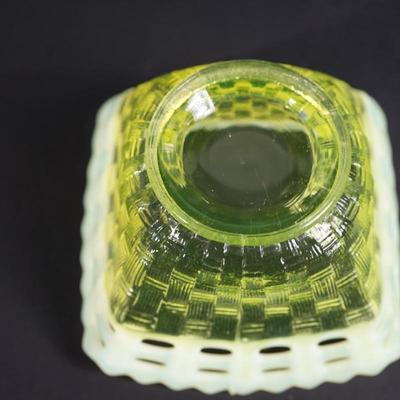 Sale Photo Thumbnail #36: At auction is a grouping of three Fenton candy dishes in the basket weave pattern, 
Lacy edge of opalescent glass. 
Mold blown 
early 1930's 
Uranium content glows under UV light 

round bowl measures: 7" across the top 
Height : 1 3/4" 
condition; very g